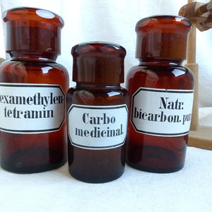 Conjunto de 3 colección de botellas de farmacia de vidrio ámbar antiguo. Etiqueta de esmalte pintado. Gabinete de curiosidades. Exhibición científica. Química. Boticario