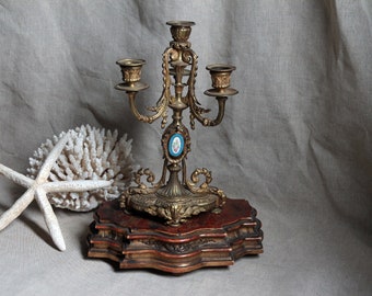 Antique french gilded bronze candelabra. Louis XVI four arm candle holder. Baroque style decor. French chateau style.