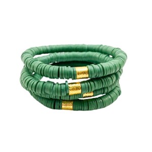 May include: Four stacked green bracelets with gold accents. Each bracelet is made of small, round beads.