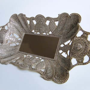 Vintage metal bowl with ornaments