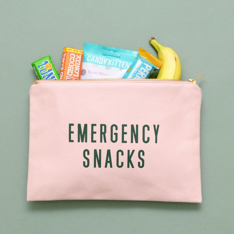 a zip up pouch that says 'Emergency snacks'