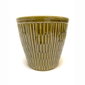 May include: A green ceramic planter with a textured, vertical pattern. The planter has a slightly flared shape and a smooth rim. The color is a muted olive green, and the design is repeated around the entire circumference.