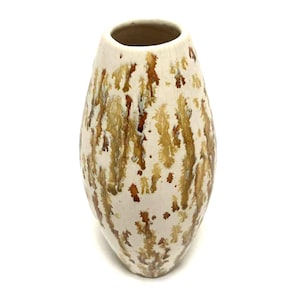 May include: A ceramic vase with a cream-colored base and a speckled pattern of brown and gold. The vase has a rounded, elongated shape with a wide opening at the top. The decorative vase is suitable for displaying flowers or as a standalone art piece.