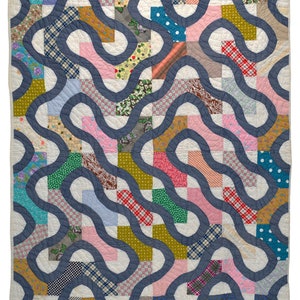 May include: A patchwork quilt with a blue background and a wavy pattern. The quilt is made of various fabrics with different patterns, including floral, plaid, and polka dots.