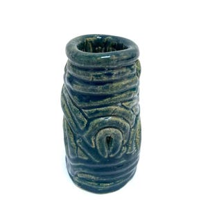 May include: A set of three ceramic mugs with a speckled, matte finish. The mugs are in shades of cream, light gray, and dark gray. Each mug has a simple, minimalist design, perfect for coffee or tea.