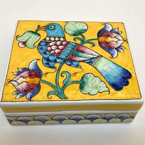 May include: A set of three ceramic mugs with a speckled, matte finish. The mugs are in shades of cream, light gray, and dark gray. Each mug has a simple, minimalist design, perfect for coffee or tea.