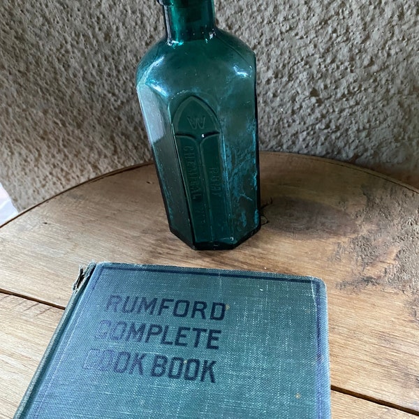 Antique Rumford cookbook and Rumford bottle  Copyright 1927.  236 page basic cookbook from soup to nuts.  Bottle is a beautiful teal.