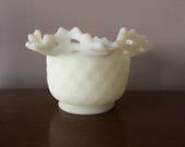 Vintage Fenton custard glass vase. Lacey open basketweave pattern. Uranium custard glass. Makers mark on bottom.