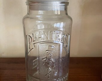 Vintage dated Planters anniversary collector’s jar.  The company celebrated 75 years in 1961.  That makes this storage jar 64 years old.