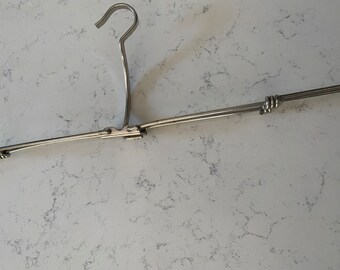 Antique collapsible travel hanger.  Clever and made of sturdy metal- what a great item!  They don’t make these anymore!  Unusual.