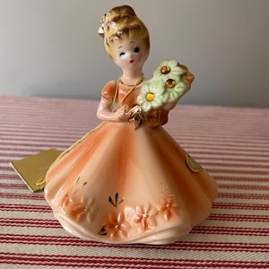 Vintage Josef Original birthstone month figurine.  November with “topaz “ stones and orange gown.  Pretty little collectible.