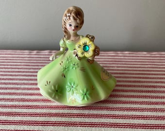 Vintage Josef Original birthstone month figurine.  May  with “emerald “ stone and green gown.  Pretty little collectible. Original hang tag.