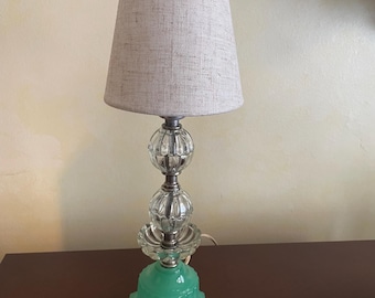Vintage Jadeite glass lamp in great working condition.  Pre - owned vintage lamp.  Pretty and authentic.  Shown with LED low wattage bulb.