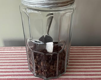 Antique glass hoosier style jar with original metal lid.  Please read description.  Jar is in great shape, the lid is worn.  Storage jar