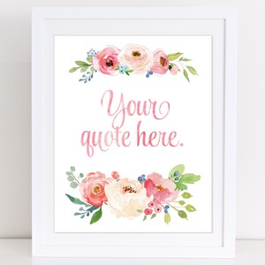 May include: A framed print featuring watercolour floral arrangements in pink, peach, and white. The text "Your quote here" is in pink script. The white frame provides a clean, modern aesthetic, suitable for home decor.