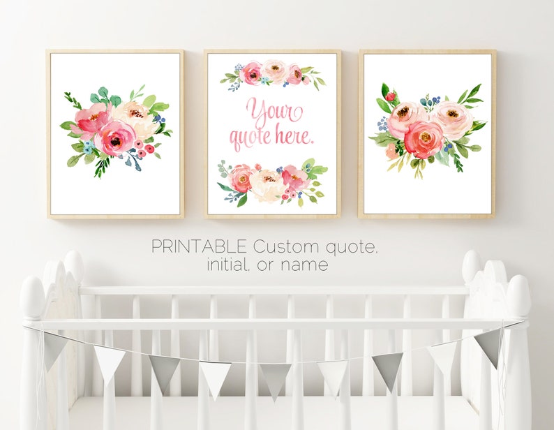 May include: Three framed floral art prints. Each print features watercolour flowers in shades of pink, peach, and green. One print has the text "Your quote here." The frames are light wood, and the overall theme is soft and feminine.
