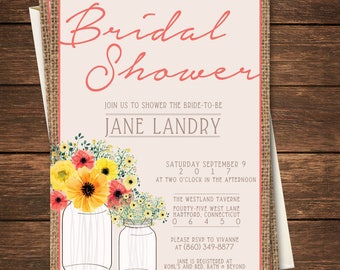 May include: A pink and white bridal shower invitation with a burlap background. The invitation features a watercolor illustration of two mason jars filled with yellow and orange flowers. The text on the invitation reads "Bridal Shower", "Join us to shower the bride-to-be", "Jane Landry", "Saturday September 9, 2017", "At two o'clock in the afternoon", "The Westland Taverne", "Fourty-five West Lane", "Hartford, Connecticut 06450", "Please RSVP to Vivianne at (860) 349-8877", and "Jane is registered at Kohl's and Bed, Bath & Beyond".