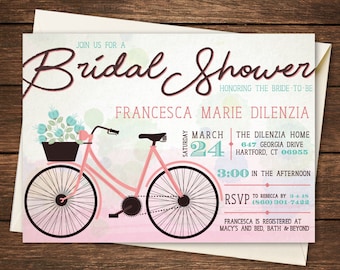 May include: A pink bicycle with a basket of blue flowers on the handlebars. The bicycle is on a watercolor background with pink and blue hues. The text on the invitation reads "Join us for a Bridal Shower honoring the bride-to-be Francesca Marie Dilanzia, Saturday March 24, The Dilanzia Home, 647 Georgia Drive, Hartford, CT 06955, 3:00 in the afternoon, RSVP to Rebecca by 3-4-15 (860) 301-7422, Francesca is registered at Macy's and Bed, Bath & Beyond."