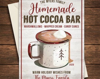 May include: A holiday greeting card with a rustic design. The card features the text "Homemade Hot Cocoa Bar" and a mug of hot cocoa with a marshmallow. The card also includes the text "Warm Holiday Wishes from The Myers Family."