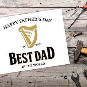 May include: A white card with the text "Happy Father's Day to the Best Dad in the World" and a gold harp logo.