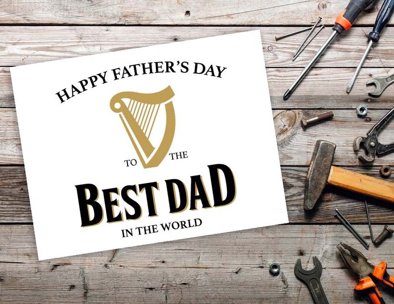 May include: A white card with the text "Happy Father's Day to the Best Dad in the World" and a gold harp logo.