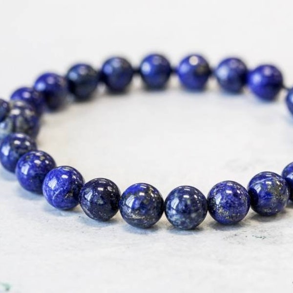 Natural Lapis Lazuli 8mm smooth round Power Bead Bracelet Natural royal blue elastic cord bracelet About 7.5 inches long One size fits all