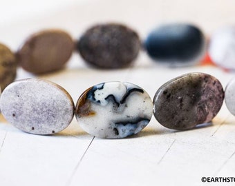 May include: A bracelet made of oval-shaped, natural agate beads. The beads are a mix of white, gray, brown, and black colors with a marbled pattern.