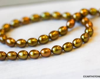 S/ Freshwater Pearl 6x8mm Oval Rice beads 16" strand Dyed golden yellow color pearl Size varies For jewelry making