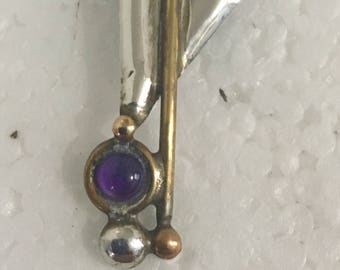 Sterling silver pendant with brass accents and amethyst stones