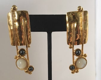 Gold plated brass rectangle stud earrings with gold plated brass wire accents and hematite and mother of pearl stones