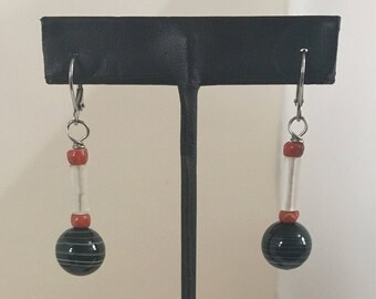 Red, clear, and black and white bead dangle lever back earrings