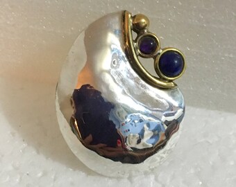 Sterling silver pendant with brass accents and lapis and amethyst stones
