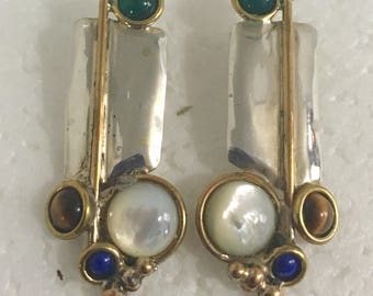 Sterling silver stud earrings with brass wire accents and lapis, green onyx, tiger's eye, and mother of pearl stones