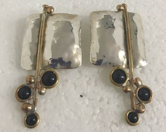 Sterling silver square stud earrings with brass wire accents with black onyx stones
