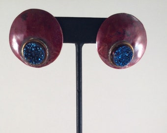 Red copper circle stud earrings with brass accents and blue druzy.