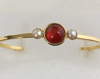 Gold plated brass cuff bracelet with carnelian and mother of pearl stones