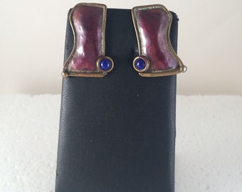 Red copper stud earrings with brass accents and lapis.