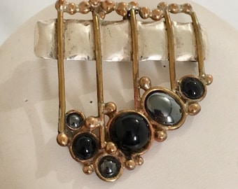 Sterling silver rectangle pendant/pin with brass wire accents and hematite and black onyx stones