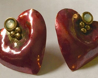 Red copper heart stud earrings with brass accents and mother of pearl