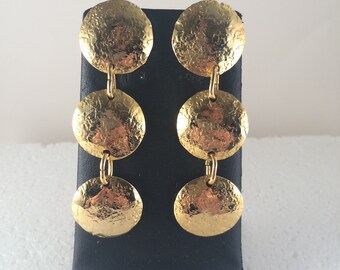 Gold plated hammered brass tri-circle dangle stud earrings.