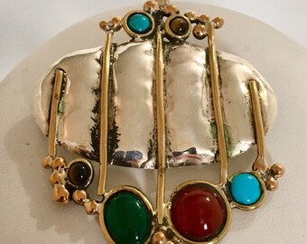 Sterling silver oval pendant/pin with brass wire accents and amethyst, tiger's eye, turquoise, green onyx, and carnelian stones