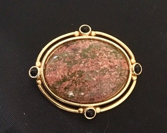 Pink/tan jasper oval pendant/pin with gold plated brass accents and 4 black onyx stones