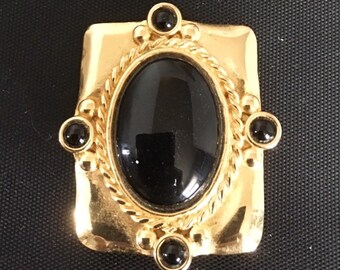 Gold plated brass rectangle pendant/pin with gold platedbrass accents, and black onyx stones