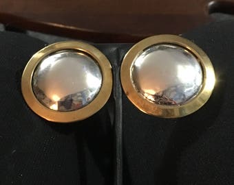 Sterling silver circle clip earrings with brass circle outline