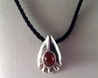 Sterling silver rain drop pendant with carnelian. Cord not included.