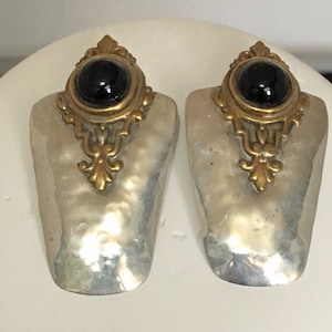 Sterling silver stud earrings with brass accents and black onyx stone