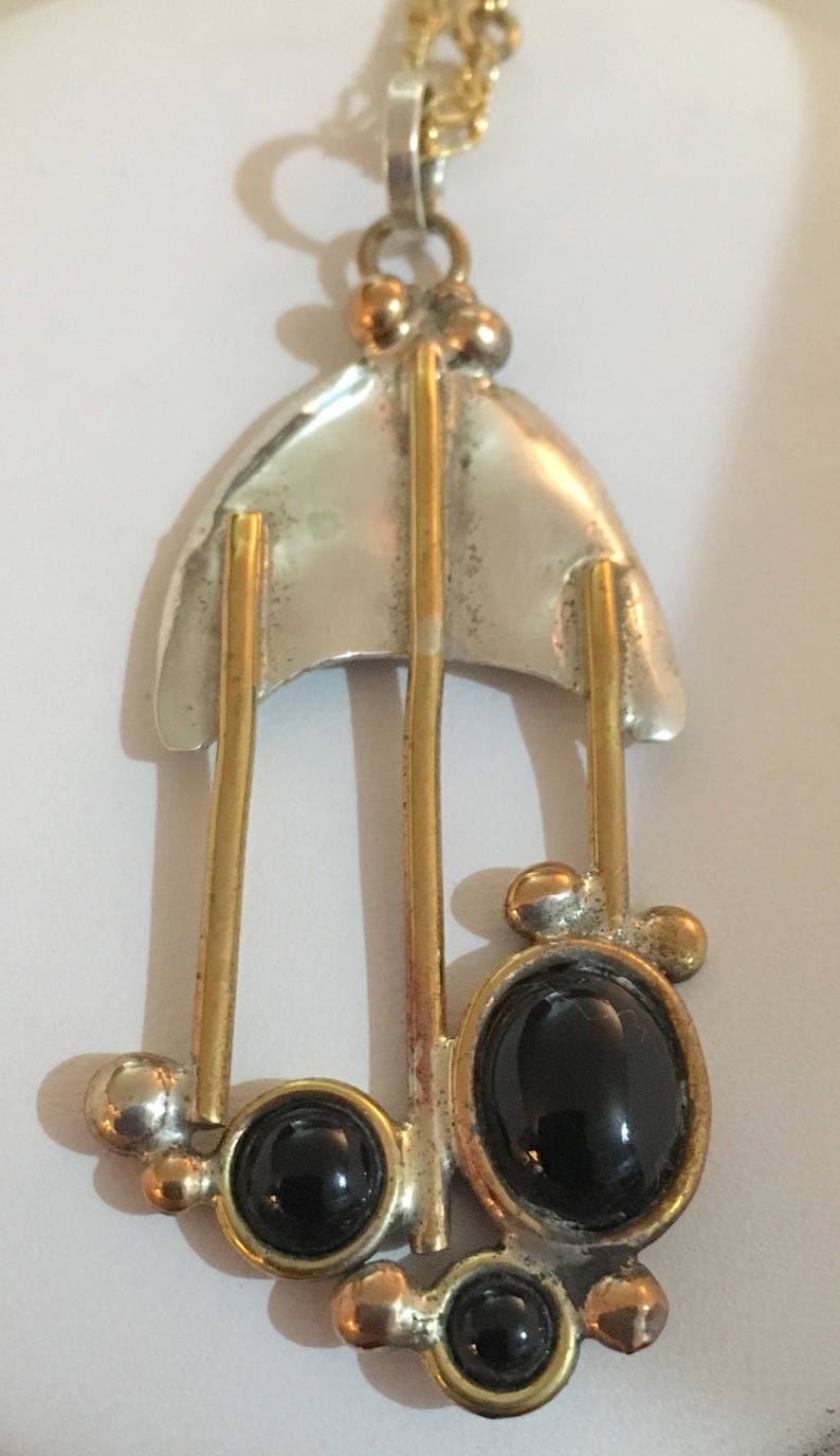 Sterling silver pendant with brass wire accents and black onyx stones chain not included image 1