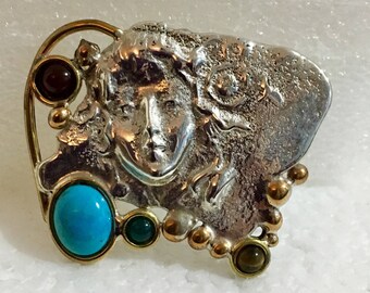 Sterling silver lady pendant/pinbwith brass accents and carnelian, turquoise, green onyx, and tiger's eye stones