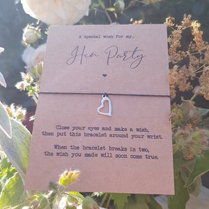 May include: A brown card with the text "A special wish for my... Hen Party" and a black string bracelet with a silver heart charm. The card includes instructions for making a wish and the bracelet breaking in two when the wish comes true.