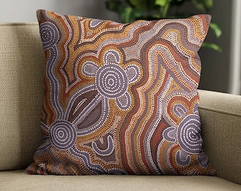 May include: A square throw pillow featuring an intricate dot art pattern in shades of terracotta, burnt orange, cream, and muted purple. The design consists of concentric circles and flowing, wavy lines created entirely from small, uniform dots.